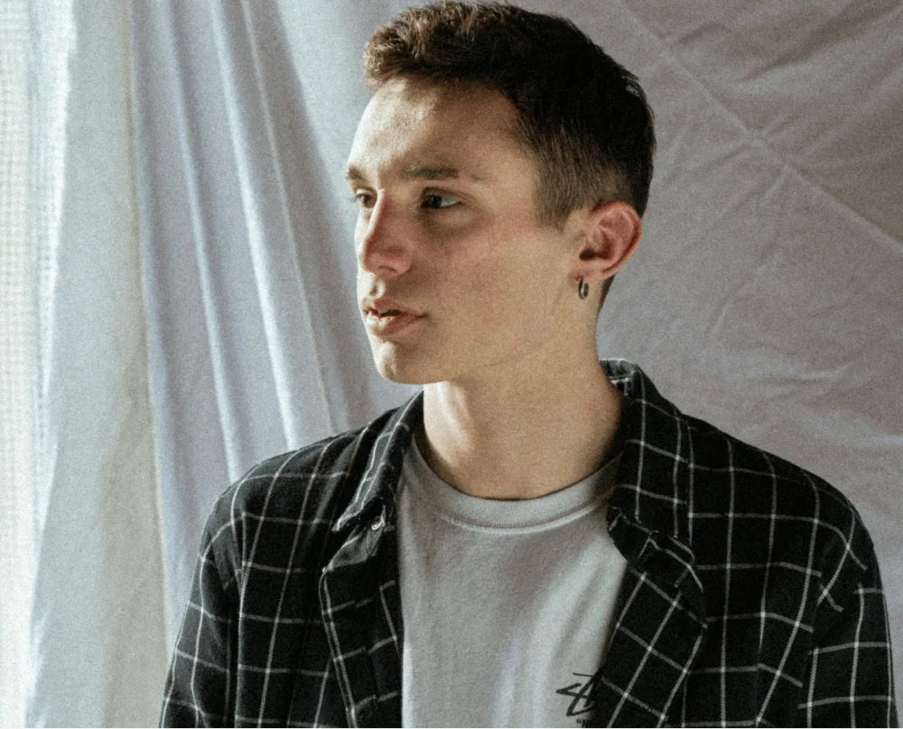 Man with a shirt looking into the distance
